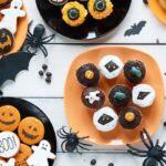 halloween snacks and cookies on plates